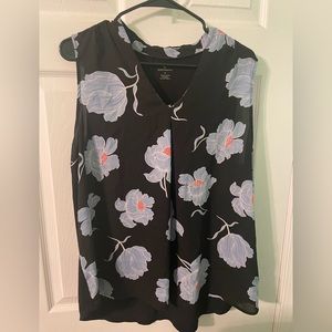 Sleeveless floral blouse. Lightly worn
